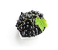 Fresh black currant in ceramic bowl isolated on white Royalty Free Stock Photo