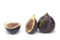 Fresh Black figs on isolated white background. Whole and sliced. Royalty Free Stock Photo