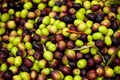 Fresh black and green olives sold at a market