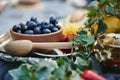 Fresh black olives in a wooden bowl near wooden spoon Royalty Free Stock Photo