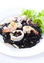 Fresh black tagliolini pasta with seafood in herbs Royalty Free Stock Photo