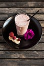 Fresh blended smoothie with ingredients on plate Royalty Free Stock Photo