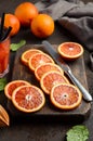 Fresh blood orange slices on wooden board Royalty Free Stock Photo