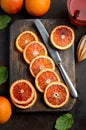 Fresh blood orange slices on wooden board