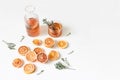 Fresh blood oranges pattern. Whole and cut fruits with thyme herb isolated on white table backgrounds. Lemonade drink
