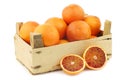 Fresh blood oranges in a wooden crate