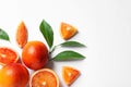 Fresh bloody oranges and leaves on white background. Citrus fruits