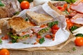 Fresh BLT Sandwich with Bacon Lettuce Tomato and Mozzarella on crumpled paper Royalty Free Stock Photo