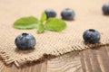 Fresh blueberries on a background of burlap and wooden Royalty Free Stock Photo