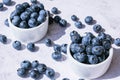 Fresh blueberries background with copy space. Blueberry antioxidant organic superfood in bowls concept for healthy Royalty Free Stock Photo