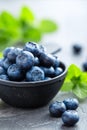 Fresh Blueberries in a bowl on dark background, top view. Juicy wild forest berries, bilberries. Royalty Free Stock Photo