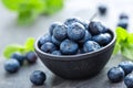 Fresh Blueberries in a bowl on dark background, top view. Juicy wild forest berries, bilberries. Royalty Free Stock Photo