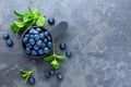 Fresh Blueberries in a bowl on dark background, top view. Juicy wild forest berries, bilberries