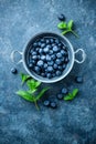 Fresh Blueberries in a bowl on dark background, top view. Juicy wild forest berries, bilberries Royalty Free Stock Photo