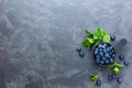 Fresh Blueberries in a bowl on dark background, top view. Juicy wild forest berries, bilberries Royalty Free Stock Photo