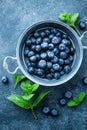 Fresh Blueberries in a bowl on dark background, top view. Juicy wild forest berries, bilberries Royalty Free Stock Photo