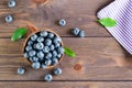 Fresh blueberries in a bowl on a wooden table. Organic Wild Superfood. Top view Royalty Free Stock Photo