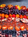 Fresh blueberries, cranberrys, apricots, apples, tomatoes, pomegranate, grape mix of fruit, flat lay, rich in resveratrol,