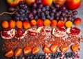 Fresh blueberries, cranberrys, apricots, apples, tomatoes, pomegranate, grape mix of fruit, flat lay, rich in resveratrol,