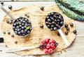 Fresh blueberries, currants and raspberries, rustic, top view Royalty Free Stock Photo