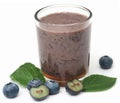 Fresh blueberries and juice in a glass Royalty Free Stock Photo