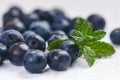 Fresh blueberries with mint on a wooden white table. Natural antioxidant. Concept of healthy food. Organic superfood Royalty Free Stock Photo