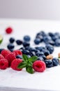 Fresh blueberries with mint on a wooden white table. Natural antioxidant. Concept of healthy food. Organic superfood Royalty Free Stock Photo