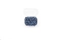 Fresh blueberries in a plastic container on the white background