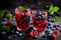Fresh blueberries and raspberries in a glass of berry