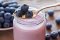 Fresh blueberries yogurt in glass jar Royalty Free Stock Photo