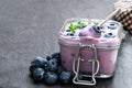 Fresh blueberries yogurt in glass jar on white wooden table Royalty Free Stock Photo