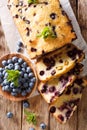 fresh blueberry loaf of bread muffin cake with mint closeup. vertical top view Royalty Free Stock Photo