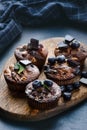 Fresh, blueberry muffins on a stone background with sugar and fruits. Food background. Concept of pastry. Royalty Free Stock Photo