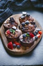 Fresh, blueberry muffins on a stone background with sugar and fruits. Food background. Concept of pastry. Royalty Free Stock Photo