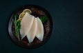 Fresh body, squid, raw, three carcasses, top view, no people , on a plate,