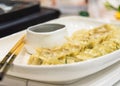Fresh boiled dumplings with hot steams on plate Royalty Free Stock Photo