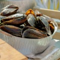 Fresh boiled mussels in iron pan. Delicious seafood. Shellfish Royalty Free Stock Photo