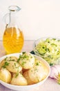 Fresh boiled potatoes with oil and salad Royalty Free Stock Photo