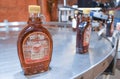 A fresh bottle of maple syrup comes off the line at Ben`s Sugar Shack in Temple, N.H., USA, March 24, 2018. Royalty Free Stock Photo