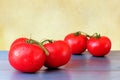 Fresh branch tomatoes on vintage blue wooden table