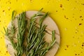 Fresh branches of rosemary herb on cutting board Royalty Free Stock Photo