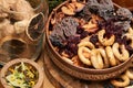 Fresh bread, bagels, dried fruits, seeds, salt, jar and wheat on the wooden - still life and healthy eating concept Royalty Free Stock Photo