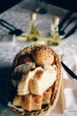 Fresh bread in basket. Slices roll breads in basket on table Royalty Free Stock Photo