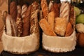 Fresh bread in a basket on the table. assortment of pastries on the table. bakery products Royalty Free Stock Photo