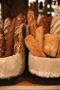 Fresh bread in a basket on the table. assortment of pastries on the table. bakery products Royalty Free Stock Photo