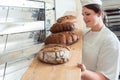 Fresh bread on a board in bakehouse of bakery