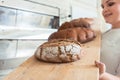 Fresh bread on a board in bakehouse of bakery