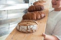 Fresh bread on a board in bakehouse of bakery