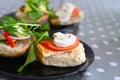 Fresh bread buns sandwiches served with egg omelet and vegetables on a plate