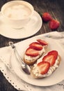 Fresh bread with Cottage cheese, strawberry and honey. Toned image Royalty Free Stock Photo